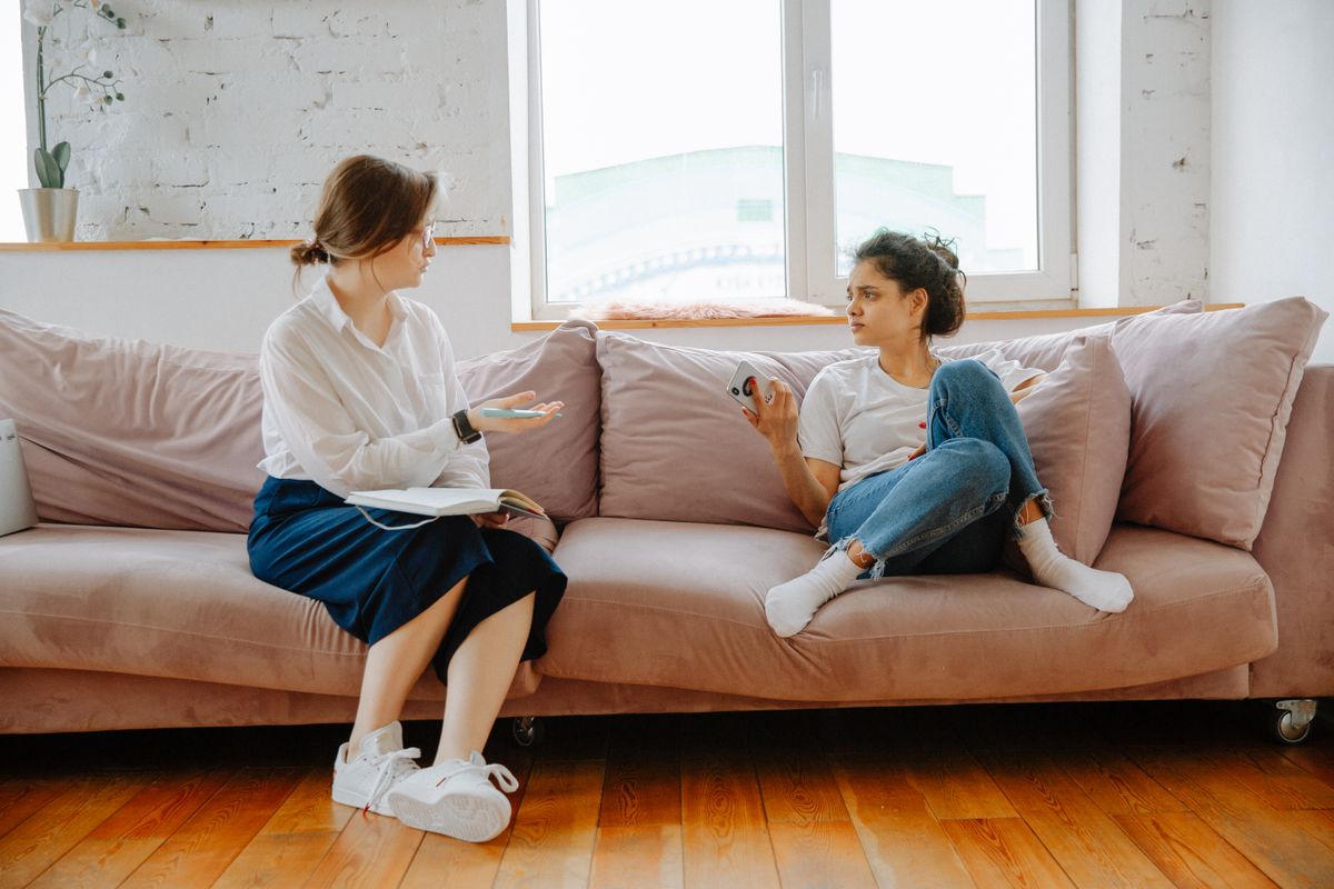 Two women talking during a supportive consultation